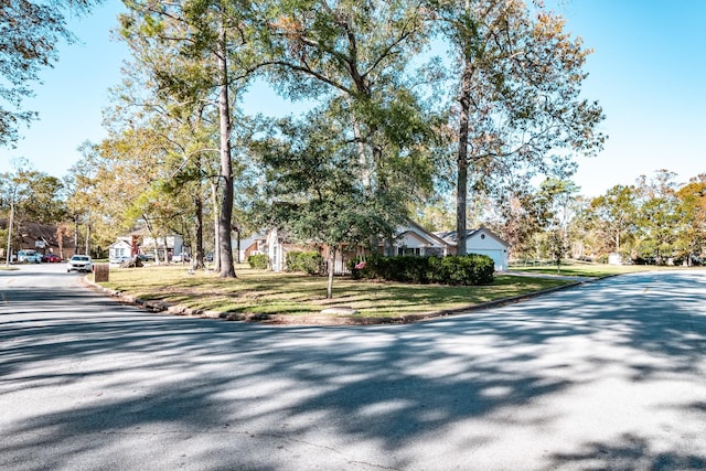 2006 Halyard Dr, Crosby, TX 77532 - view of asphalt street featuring curbs and a residential view