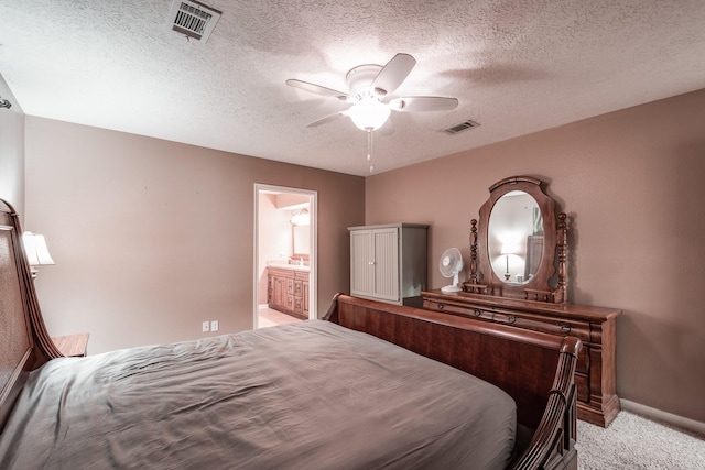 2006 Halyard Dr, Crosby, TX 77532 - bedroom with light colored carpet, a textured ceiling, a ceiling fan, and ensuite bath