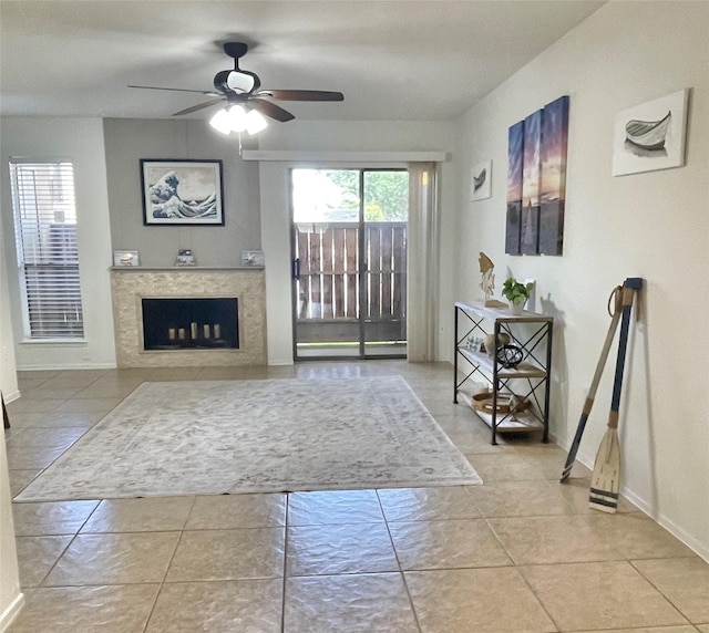 3300 Pebblebrook Dr Unit 17, Seabrook, TX 77586 - living area with a ceiling fan, a high end fireplace, and tile patterned flooring