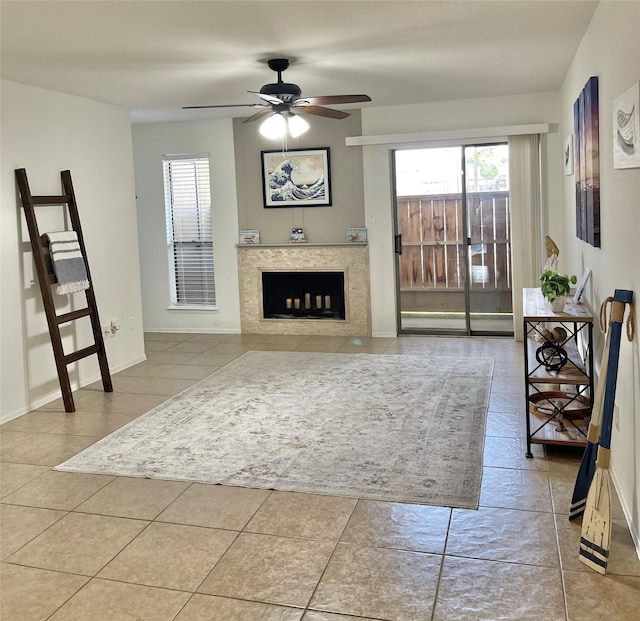 3300 Pebblebrook Dr Unit 17, Seabrook, TX 77586 - living room with a ceiling fan, tile patterned flooring, and a fireplace