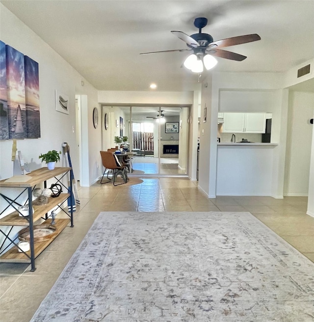 3300 Pebblebrook Dr Unit 17, Seabrook, TX 77586 - living area with ceiling fan and light tile patterned floors