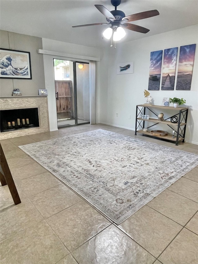 3300 Pebblebrook Dr Unit 17, Seabrook, TX 77586 - unfurnished living room with a ceiling fan, tile patterned floors, and a fireplace
