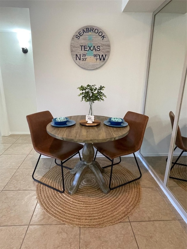 3300 Pebblebrook Dr Unit 17, Seabrook, TX 77586 - dining area with light tile patterned floors and baseboards