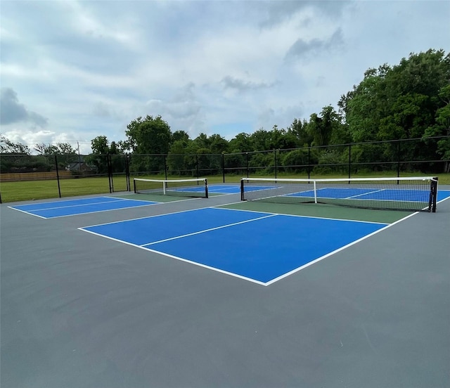 3300 Pebblebrook Dr Unit 17, Seabrook, TX 77586 - view of tennis court featuring community basketball court