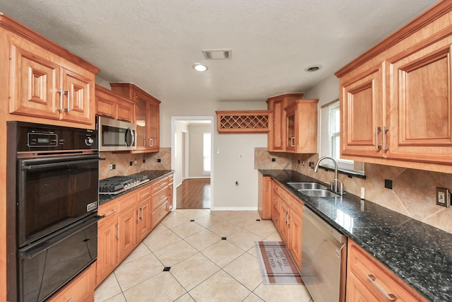 346 Ballantrae Ln, Houston, TX 77015 - kitchen featuring appliances with stainless steel finishes, plenty of natural light, light tile patterned floors, decorative backsplash, and recessed lighting