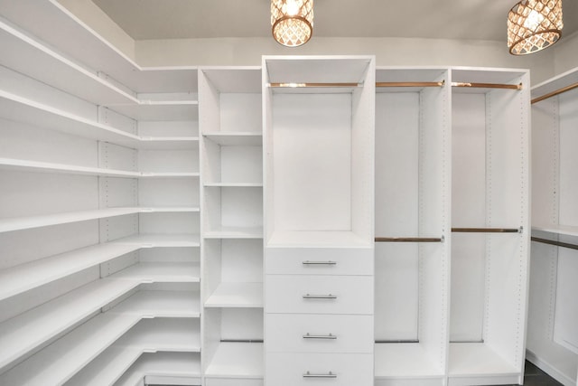 346 Ballantrae Ln, Houston, TX 77015 - walk in closet with a chandelier