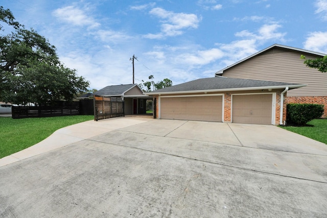 346 Ballantrae Ln, Houston, TX 77015 - view of front of house featuring a garage, driveway, and brick siding