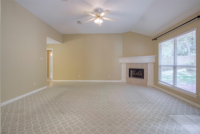 2115 Greentree Dr, Huntsville, TX 77340 - unfurnished living room with a ceiling fan, lofted ceiling, a fireplace, and light colored carpet