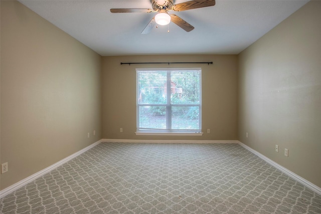 2115 Greentree Dr, Huntsville, TX 77340 - carpeted empty room with a ceiling fan and baseboards