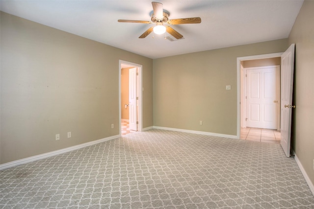 2115 Greentree Dr, Huntsville, TX 77340 - empty room with a ceiling fan and light carpet
