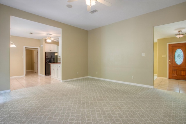 2115 Greentree Dr, Huntsville, TX 77340 - unfurnished living room featuring ceiling fan and light tile patterned floors