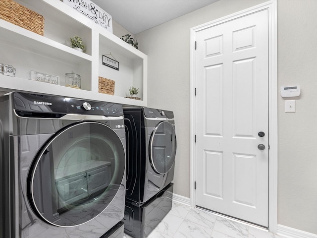 9440 Caddo Ridge Ln, Cypress, TX 77433 - laundry area with washer and dryer and light marble finish flooring