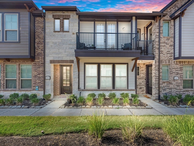 9440 Caddo Ridge Ln, Cypress, TX 77433 - townhome / multi-family property with a balcony