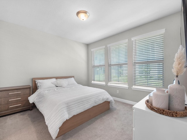 9440 Caddo Ridge Ln, Cypress, TX 77433 - bedroom featuring light carpet and baseboards
