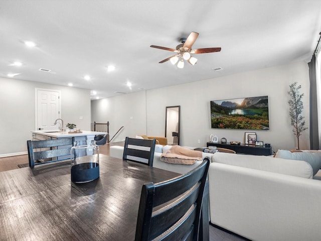 9440 Caddo Ridge Ln, Cypress, TX 77433 - dining area featuring a ceiling fan, dark wood-style floors, and recessed lighting