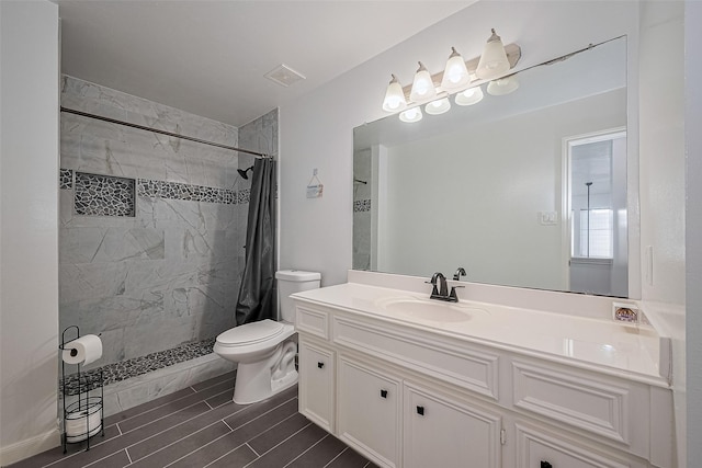 14212 Rocky Briar Ln, Rosharon, TX 77583 - bathroom with vanity, a tile shower, and wood finish floors
