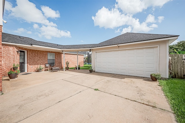 14212 Rocky Briar Ln, Rosharon, TX 77583 - view of front of home with driveway, brick siding, and an attached garage