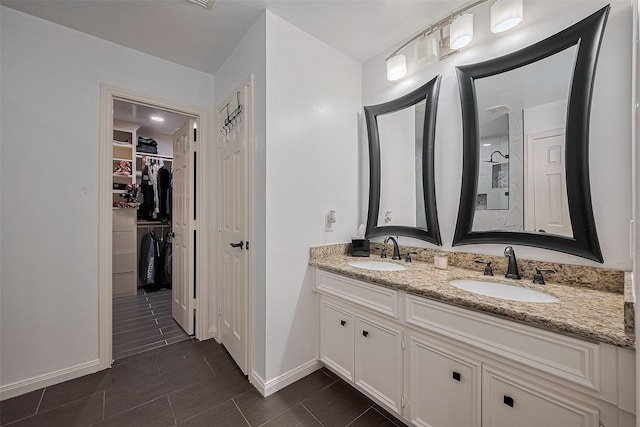14212 Rocky Briar Ln, Rosharon, TX 77583 - full bathroom with double vanity and a spacious closet