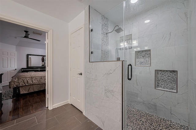 14212 Rocky Briar Ln, Rosharon, TX 77583 - ensuite bathroom featuring a stall shower, ceiling fan, and wood finished floors