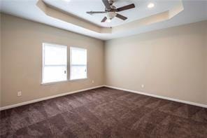 3510 Indian Mound Trl, Crosby, TX 77532 - unfurnished room with a tray ceiling, dark carpet, recessed lighting, and ceiling fan