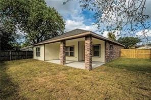 3510 Indian Mound Trl, Crosby, TX 77532 - back of house featuring a fenced backyard and a patio