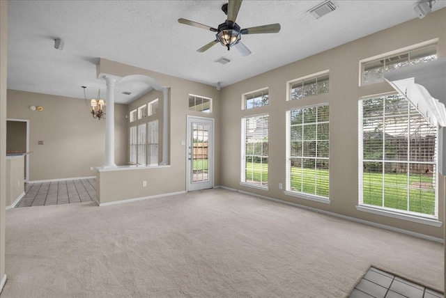 110 Crimson Bay Dr, League City, TX 77573 - unfurnished living room featuring decorative columns, carpet floors, a ceiling fan, and a textured ceiling