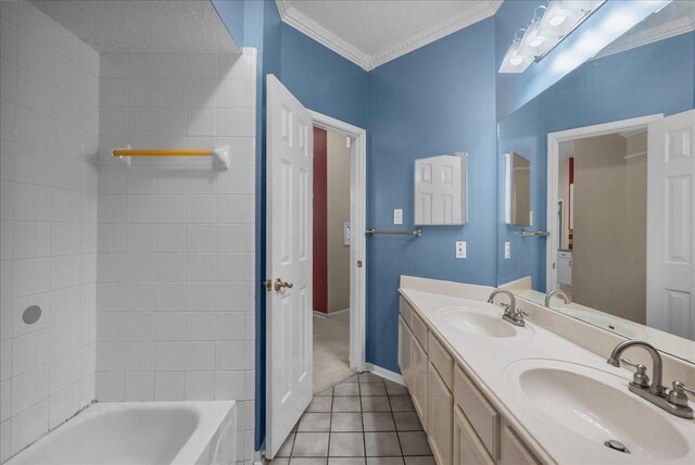 110 Crimson Bay Dr, League City, TX 77573 - full bath featuring tile patterned floors, double vanity, ornamental molding, and bathtub / shower combination