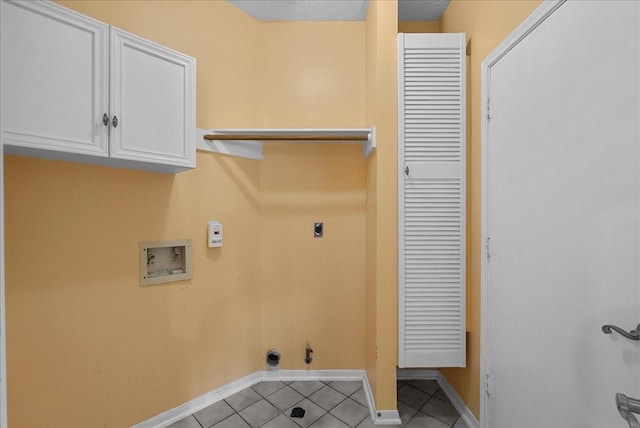 110 Crimson Bay Dr, League City, TX 77573 - laundry area featuring cabinet space, hookup for a washing machine, hookup for an electric dryer, tile patterned flooring, and hookup for a gas dryer