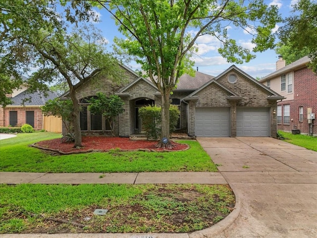 110 Crimson Bay Dr, League City, TX 77573 - view of front of home featuring an attached garage, brick siding, driveway, and a front yard
