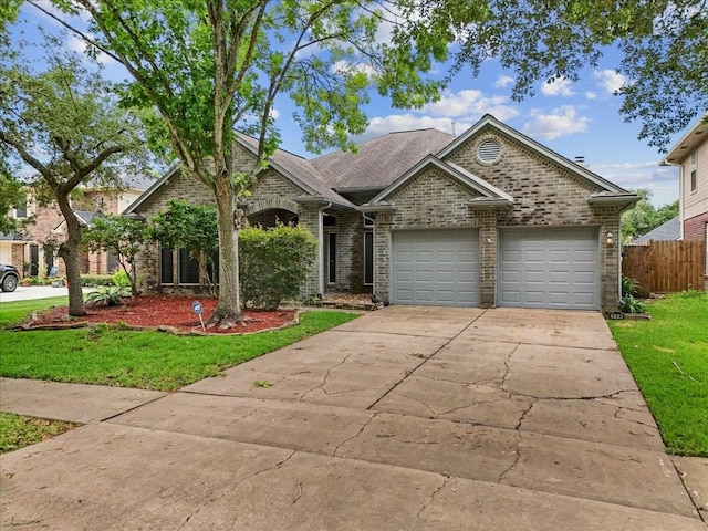 110 Crimson Bay Dr, League City, TX 77573 - view of front of house featuring driveway, an attached garage, and brick siding