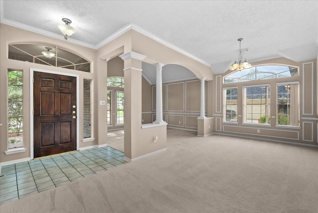 110 Crimson Bay Dr, League City, TX 77573 - carpeted entryway with a chandelier, ornate columns, a textured ceiling, healthy amount of natural light, and crown molding
