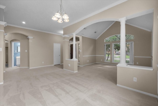 110 Crimson Bay Dr, League City, TX 77573 - empty room featuring ornate columns, arched walkways, light colored carpet, vaulted ceiling, and recessed lighting