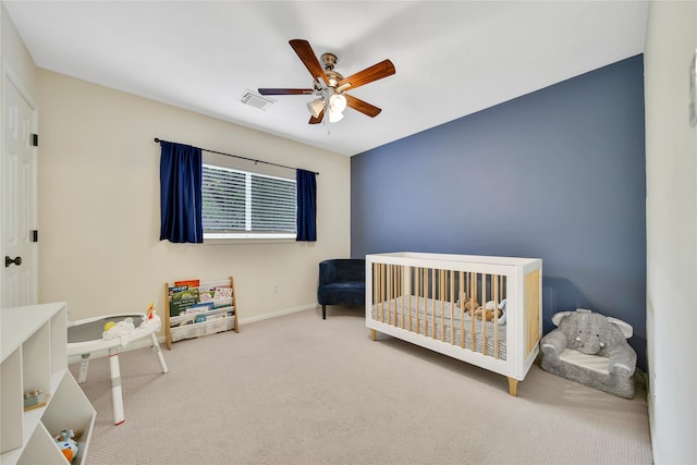 55 Bowie Bend Ct, The Woodlands, TX 77385 - carpeted bedroom with ceiling fan and a crib