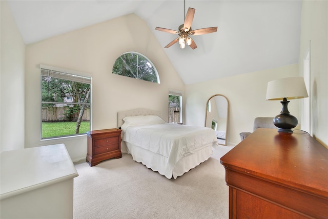 55 Bowie Bend Ct, The Woodlands, TX 77385 - bedroom featuring light colored carpet, high vaulted ceiling, and ceiling fan