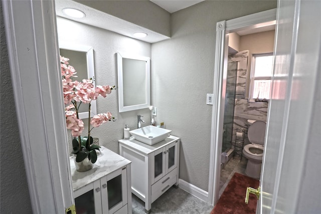 15902 Seven Springs Dr, Houston, TX 77084 - bathroom with vanity, a shower stall, and a textured wall