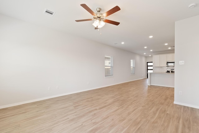 5827 Fresh View Ct, Katy, TX 77493 - unfurnished living room with recessed lighting, light wood-type flooring, and a ceiling fan