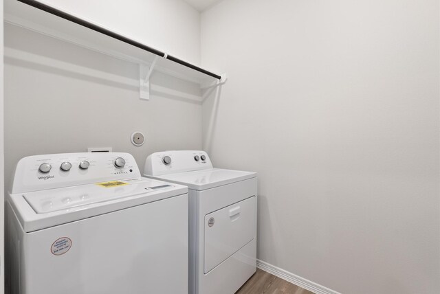 5827 Fresh View Ct, Katy, TX 77493 - washroom featuring independent washer and dryer and light wood-type flooring