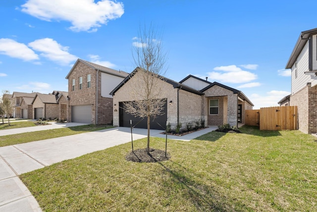 5827 Fresh View Ct, Katy, TX 77493 - view of front of home with driveway, an attached garage, a gate, and stone siding