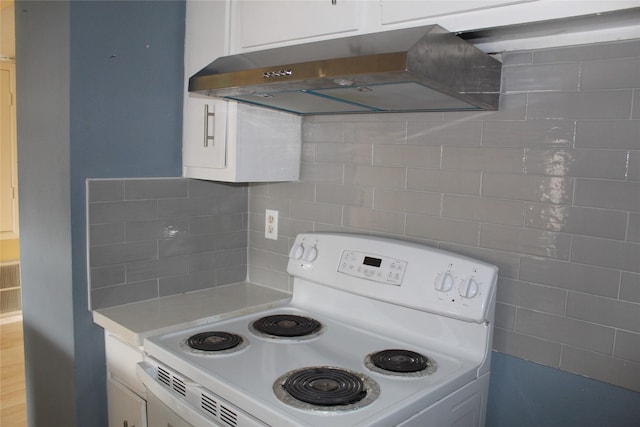 6161 Reims Rd Unit 611, Houston, TX 77036 - kitchen with white range with electric cooktop, exhaust hood, light countertops, white cabinetry, and tasteful backsplash