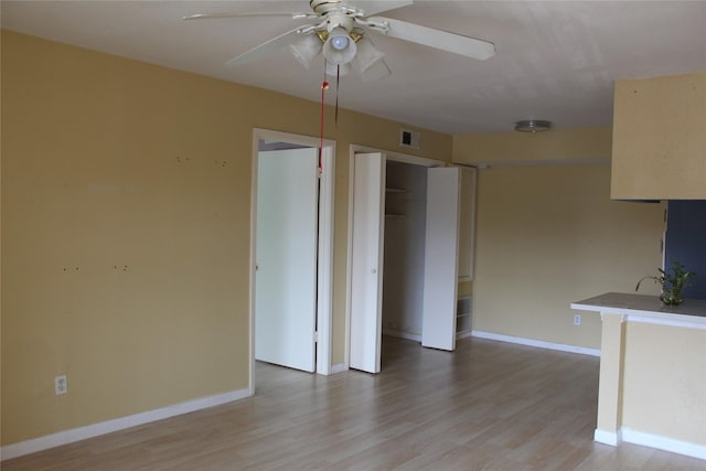 6161 Reims Rd Unit 611, Houston, TX 77036 - kitchen with a ceiling fan and light wood-style floors