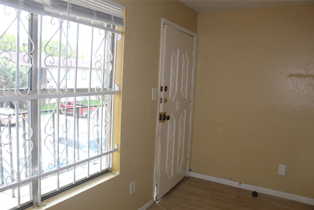 6161 Reims Rd Unit 611, Houston, TX 77036 - entryway with wood finished floors and healthy amount of natural light