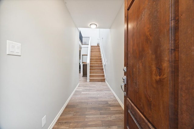 2612 Yupon St, Houston, TX 77006 - corridor featuring wood finished floors and stairs