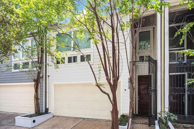 2612 Yupon St, Houston, TX 77006 - view of front of home with an attached garage and concrete driveway