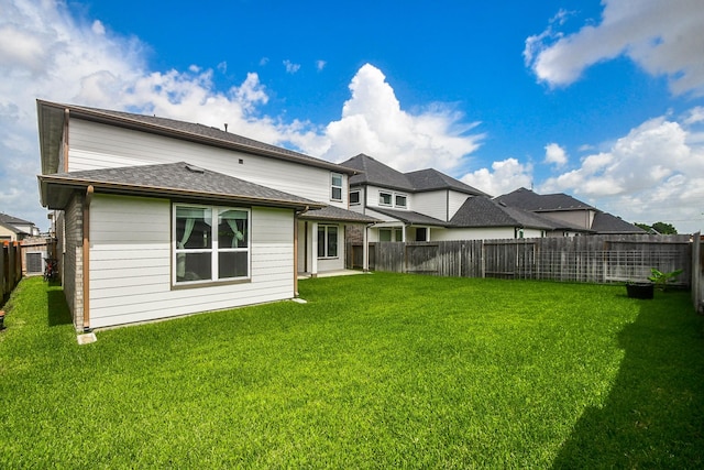 3819 Ethan Park Ct, Katy, TX 77494 - rear view of property featuring a fenced backyard and a shingled roof