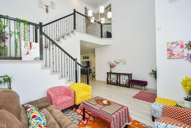 3819 Ethan Park Ct, Katy, TX 77494 - living room featuring a chandelier, wood finished floors, stairway, and a towering ceiling