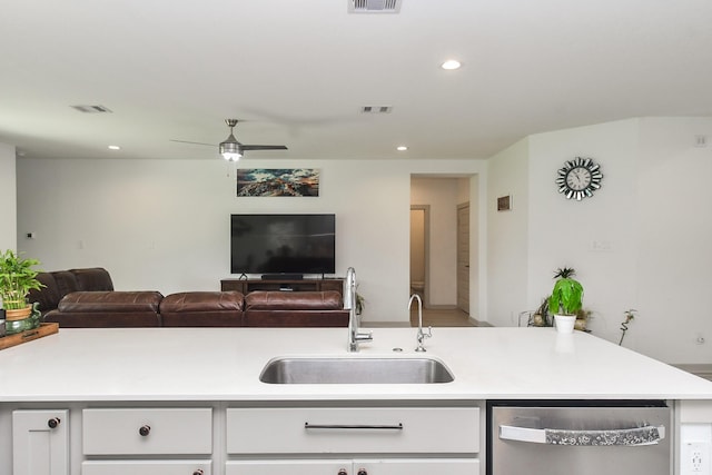 3819 Ethan Park Ct, Katy, TX 77494 - kitchen with dishwasher, light countertops, open floor plan, a ceiling fan, and white cabinets
