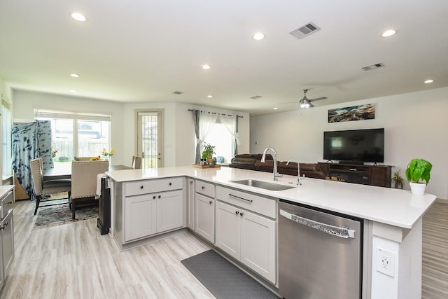 3819 Ethan Park Ct, Katy, TX 77494 - kitchen with stainless steel dishwasher, open floor plan, recessed lighting, light countertops, and ceiling fan