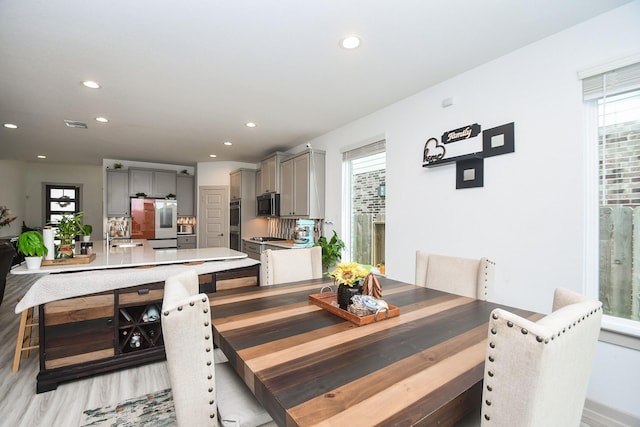 3819 Ethan Park Ct, Katy, TX 77494 - dining room featuring healthy amount of natural light, recessed lighting, and light wood-type flooring