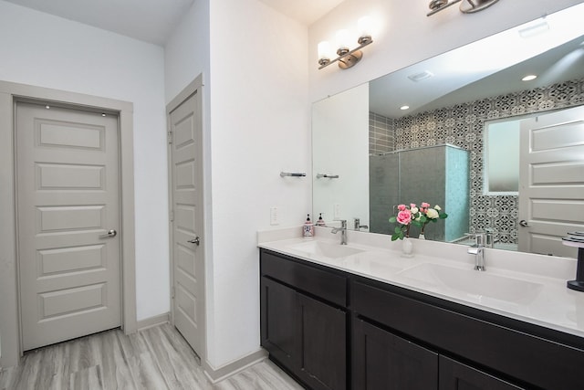3819 Ethan Park Ct, Katy, TX 77494 - full bathroom featuring double vanity, a stall shower, and wood finished floors