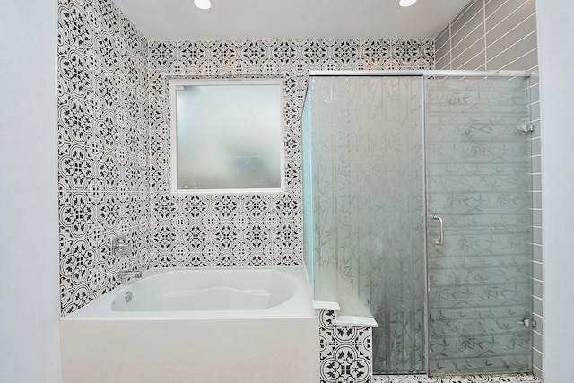 3819 Ethan Park Ct, Katy, TX 77494 - bathroom featuring a garden tub, a stall shower, recessed lighting, and wallpapered walls